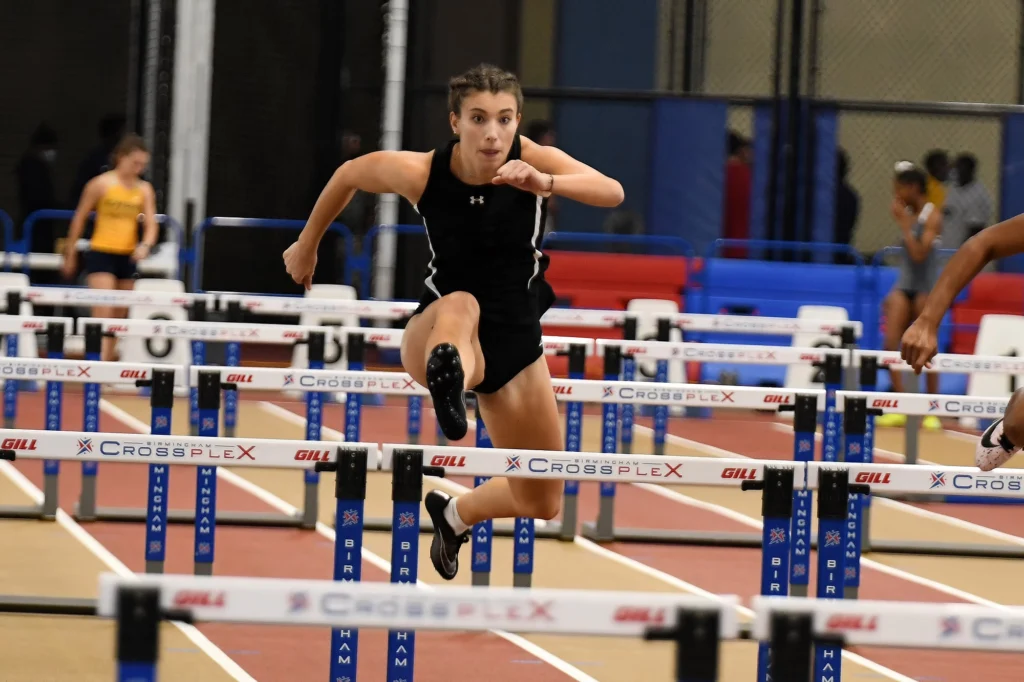 Track and field athlete jumping