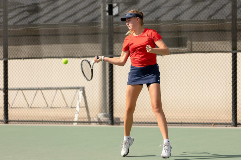 Tennis college athlete on tennis court