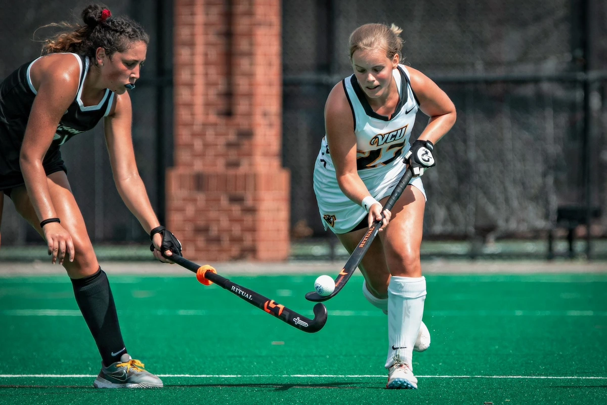 two-female-field-hockey-players.webp